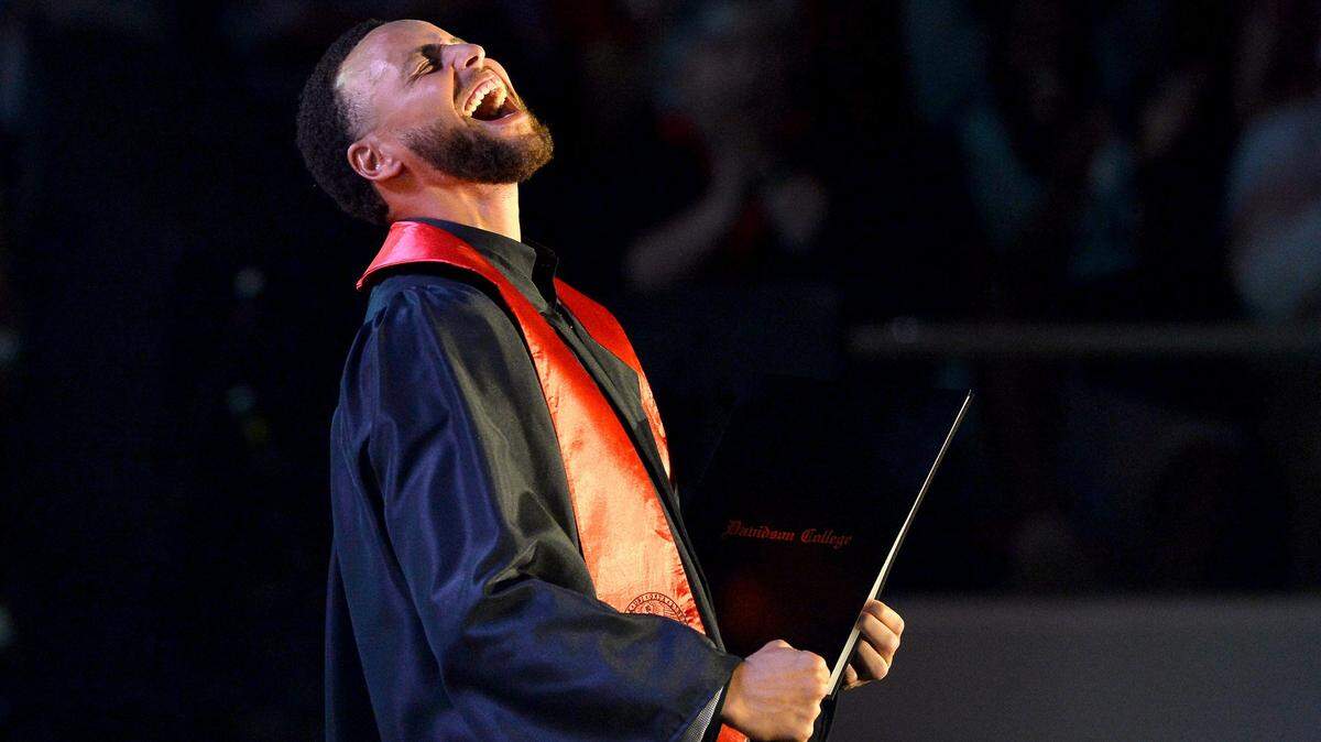 Steph Curry shows his emotion after he  received his diploma from Davidson College in 2022. Curry is now establishing a new academic scholarship program at the school.