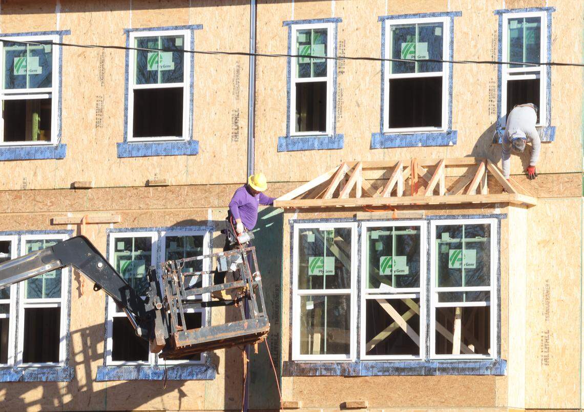 A construction crew works on a plot of land on Mallard Creek Road. It’s one of two project being built in a one-mile radius. Another proposed development would have added 195 townhomes to the area but the developer has withdrawn its rezoning petition.