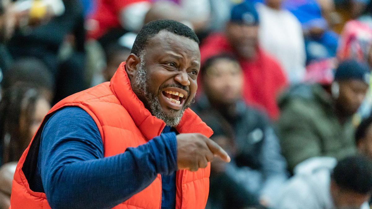 The Lady Cougar’s head coach Donnell Rhyne (left) encourages his team to defend the inbound pass.