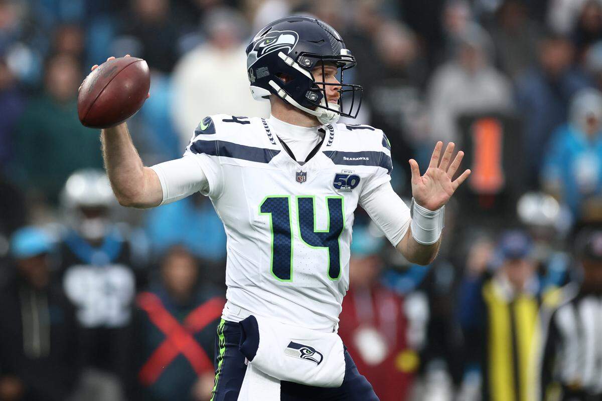 Seattle Seahawks QB Sam Darnold looks to pass against the Carolina Panthers during the second quarter of a 2025 game at Bank of America Stadium. Darnold once quarterbacked the Panthers.