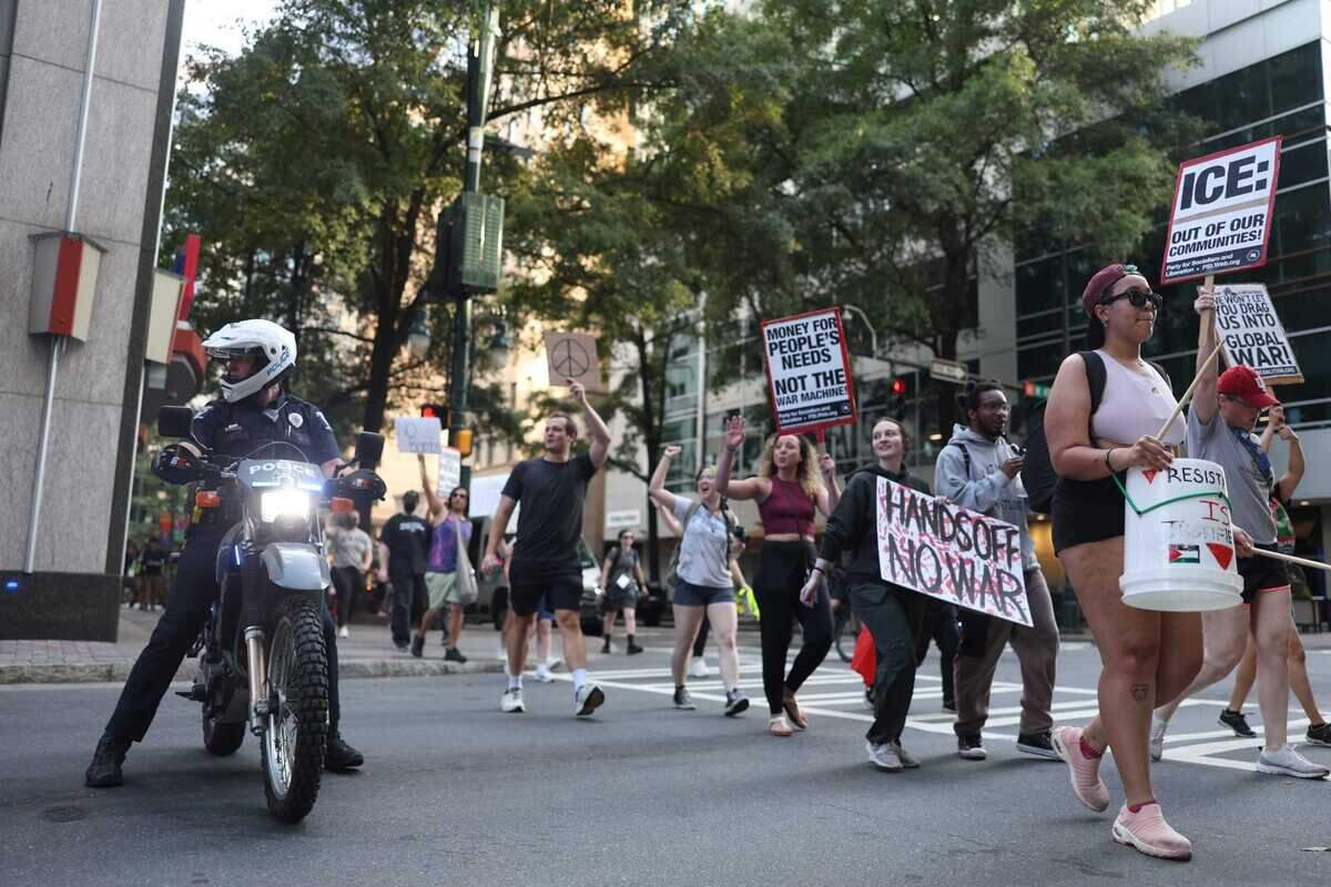 Anti-war protesters marched in uptown Charlotte on Thursday.