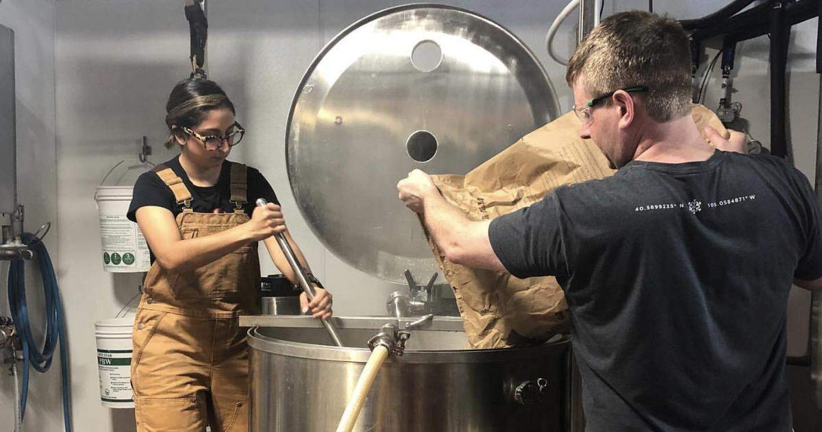 Razia Gonzalez works with Pilot Brewing co-founder Jeff Hudson on mashing in an Ales for ALS brew.