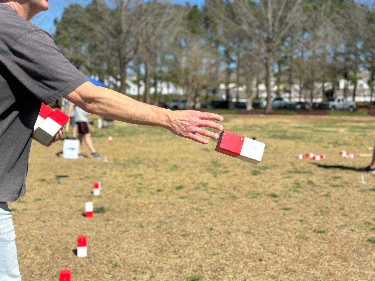 Mike Horengic tosses kubbs&nbsp;at. the North Carolina Kubb Tournament in March.