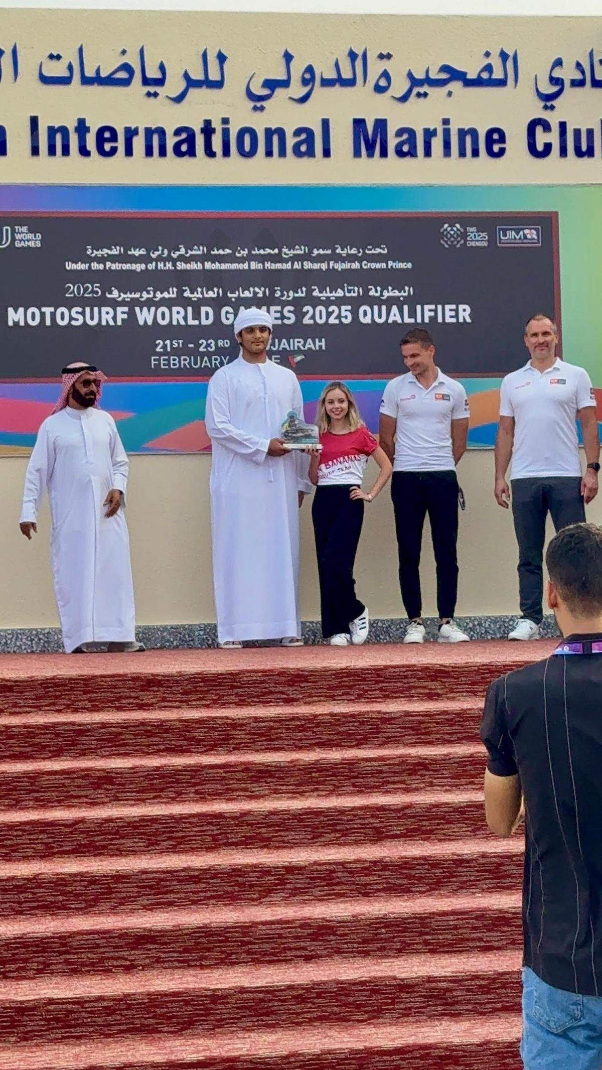 Anna Burk qualified for the World Championship in China at a qualifier competition in Fujairah, United Arab Emirates. She is shown being recognized at the qualifier.