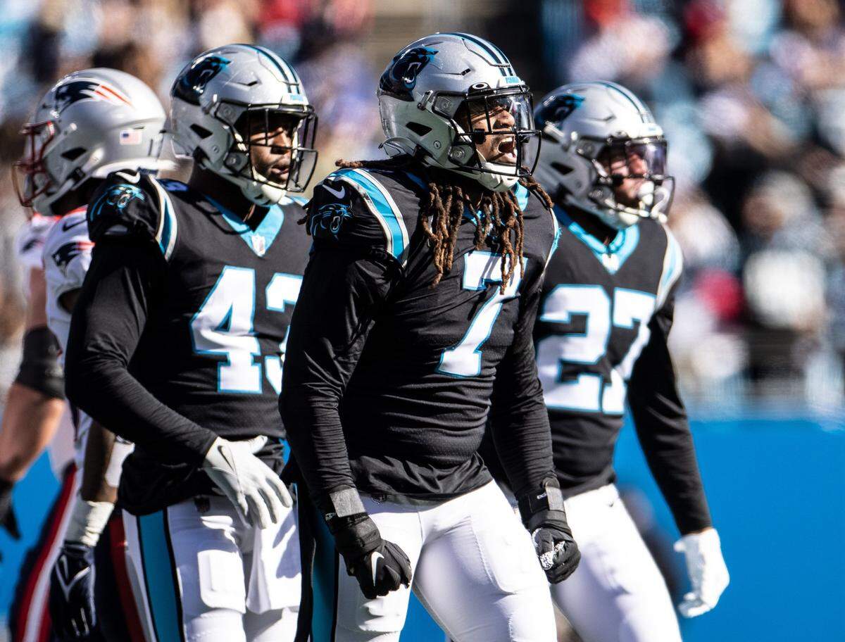 Carolina Panthers Shaq Thompson, middle, yells, during the game against the New England Patriots at the Bank of America Stadium in Charlotte, N.C., on Sunday, November 7, 2021.