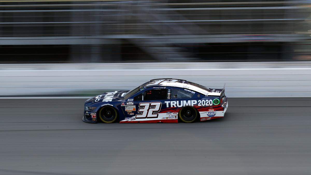 Corey LaJoie races in a car sponsored by Trump 2020 during a NASCAR Cup Series auto race at Michigan International Speedway in Brooklyn, Mich., Sunday, Aug. 9, 2020. (AP Photo/Paul Sancya)