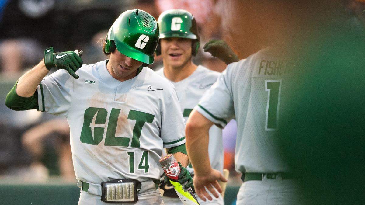 Charlotte’s Austin Knight (14) celebrates after hitting a home run during a NCAA baseball regional game between Tennessee and Charlotte held at Doug Kingsmore Stadium in Clemson, S.C., on Friday.