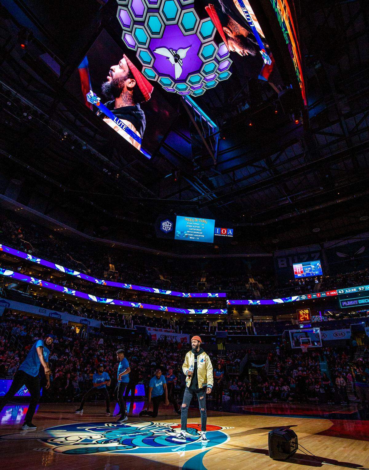 Lute, a local Charlotte artist, performs at halftime at the Spectrum Center in Charlotte on Saturday. Lute recently released his single, “GED (Gettin Every Dolla),” which is the first solo venture the Grammy-nominated artist has had since his album “West 1996 pt. 2” in 2017.