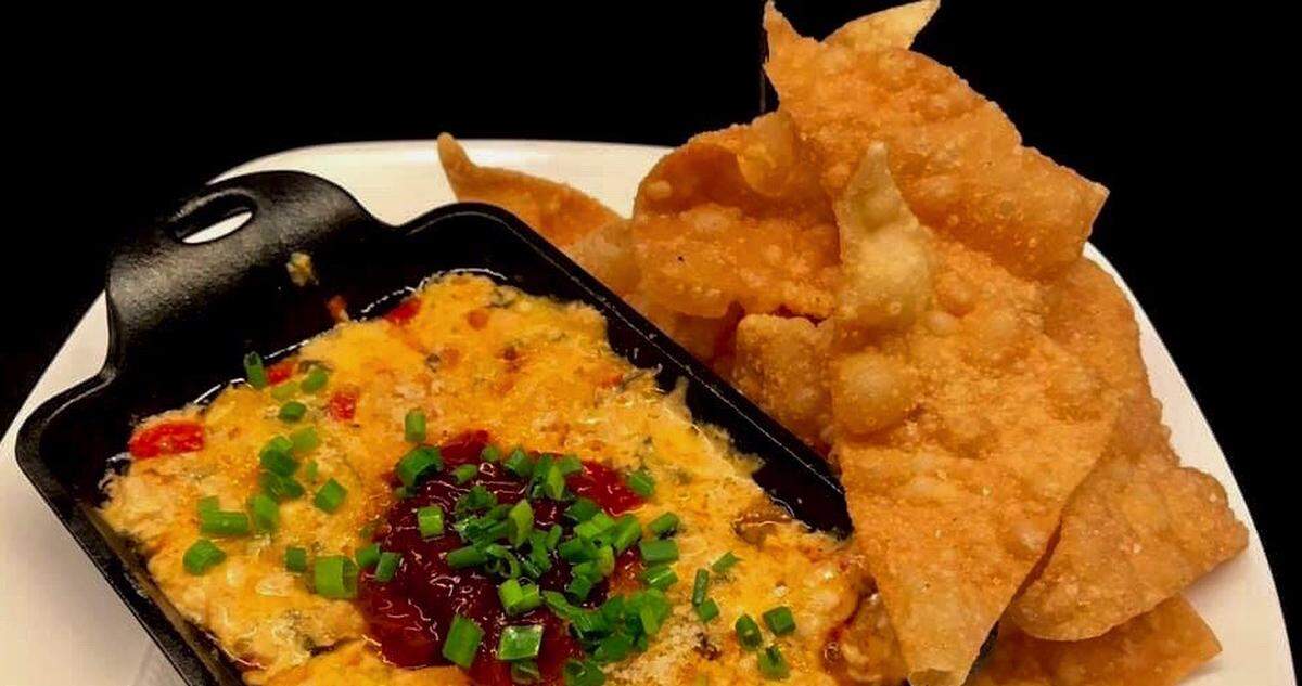 New South Kitchen changes its menu frequently, but one mainstay is baked pimento cheese with chicken sausage, red pepper marmalade and wonton chips ($8).