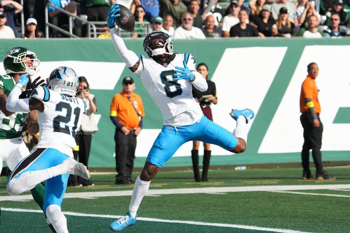 Carolina Panthers cornerback Jaycee Horn (8) intercepts a pass during the third quarter against the New York Jets  at MetLife Stadium Oct 19, 2025