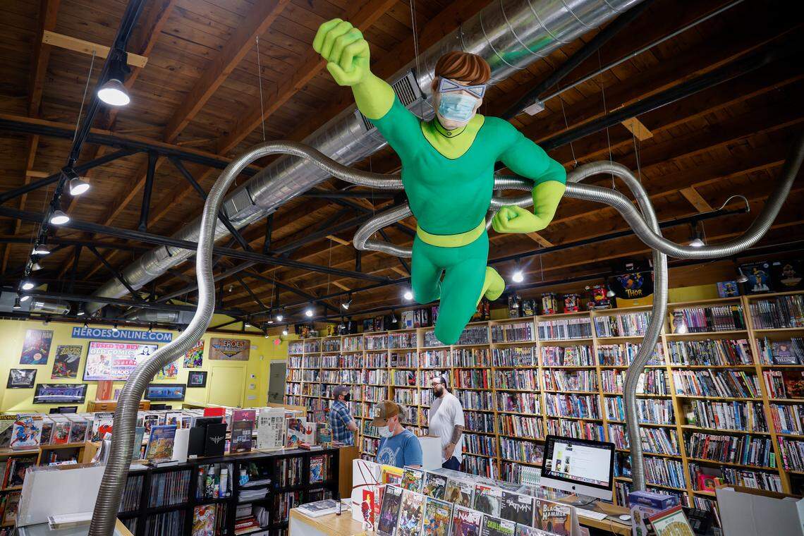 A sculpture of Doctor Octopus, a Spider-Man villain, hangs above the register at Heroes Aren’t Hard to Find comic book store in Charlotte. Store owner Shelton Drum is preparing for the 40th anniversary of his Heroes Convention this month.