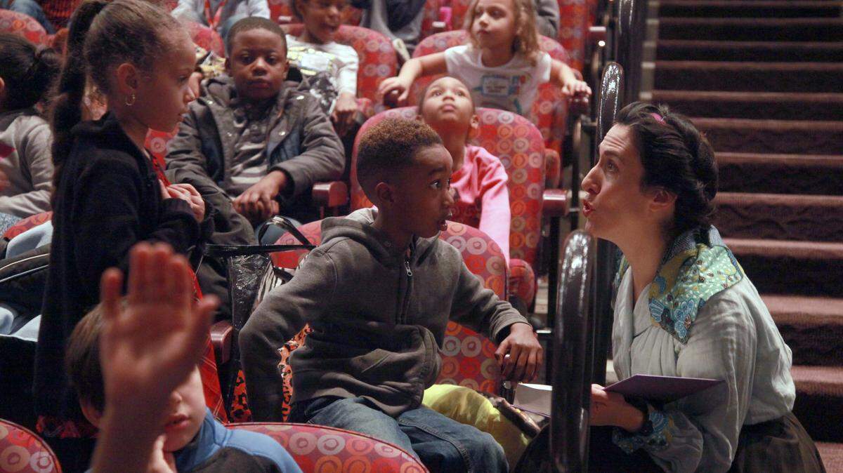 In some shows at the Children’s Theatre of Charlotte, actors interact with the audience members before the production begins, such as Journey to Oz in 2016. Julie Higginbotham of Precious Developments coaches those actors on what to do for the theater’s sensory friendly performances, meant for children with autism spectrum disorder.