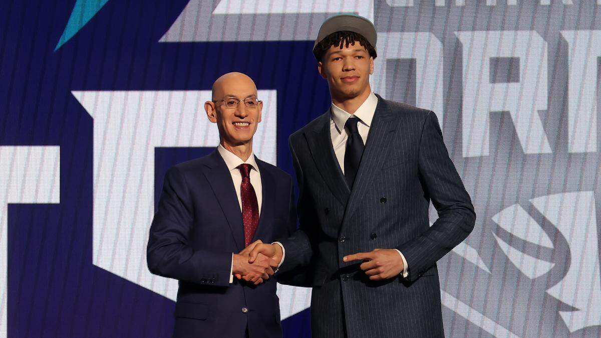 Tidjane Salaun poses for photos with NBA commissioner Adam Silver after being selected in Wednesday’s first round by the Charlotte Hornets in the 2024 NBA Draft at Barclays Center in New York. Brad Penner-USA TODAY Sports