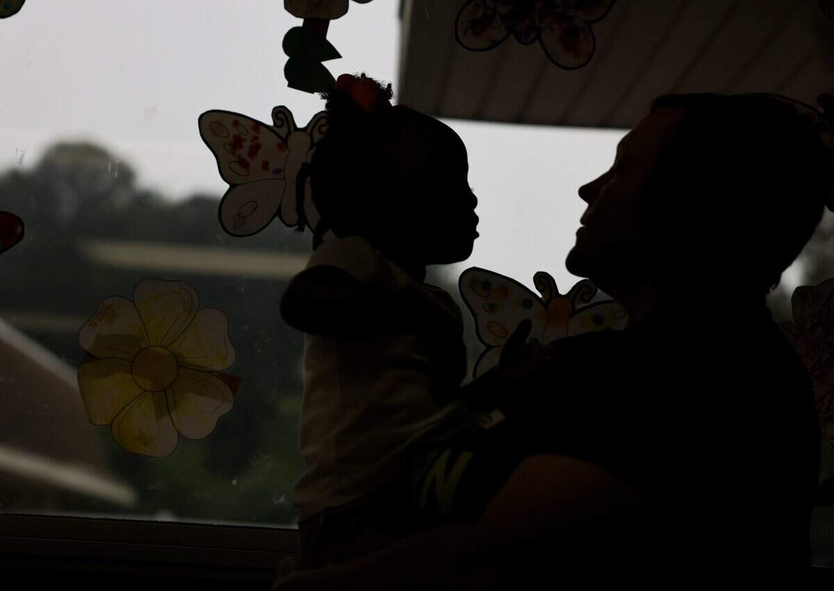 Emma Biggs, director of Pathway Preschool Center in Charlotte, talks to a child at the center on Friday, May 22, 2026.