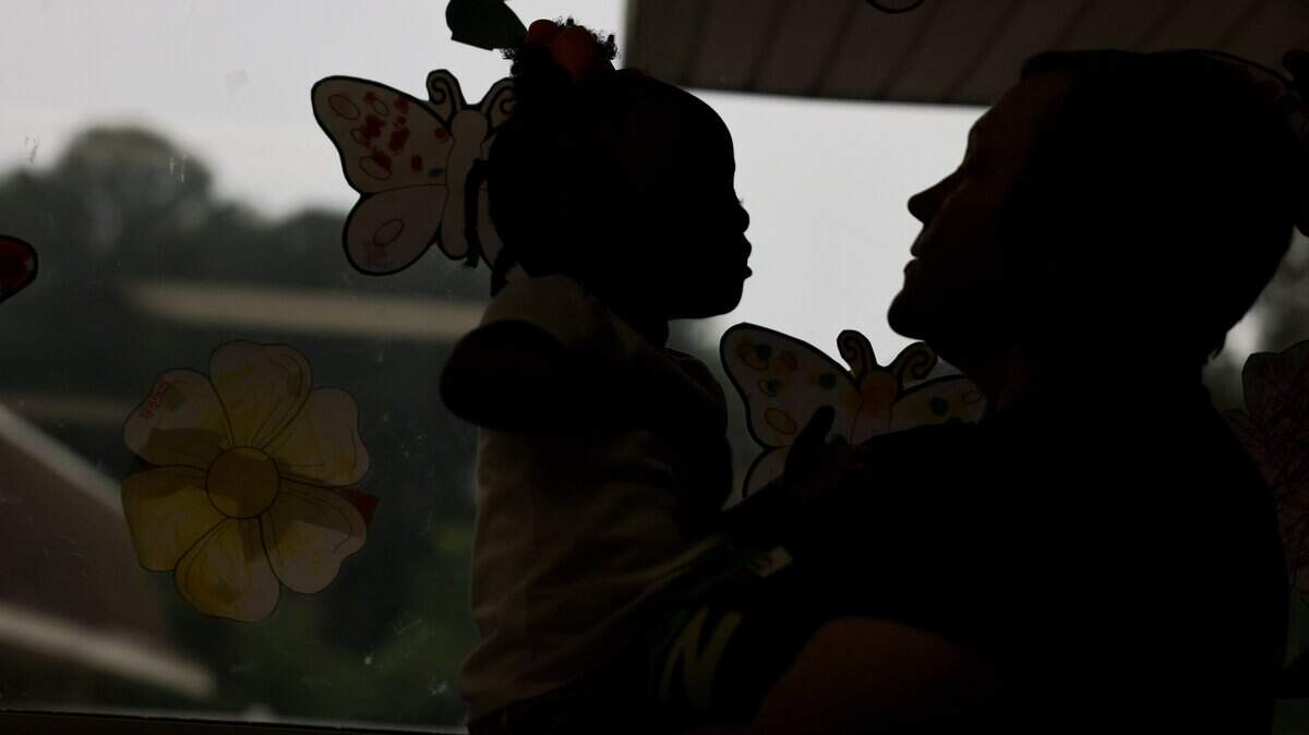 Emma Biggs, director of Pathway Preschool Center in Charlotte, talks to a child at the center on Friday, May 22, 2026.