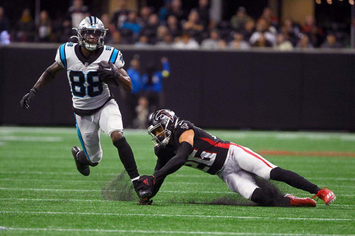 Carolina Panthers wide receiver Terrace Marshall Jr. (88) runs with the ball as Atlanta Falcons cornerback Isaiah Oliver (26) defends during the second half of an NFL football game Sunday, Oct. 30, 2022, in Atlanta. (AP Photo/John Amis)