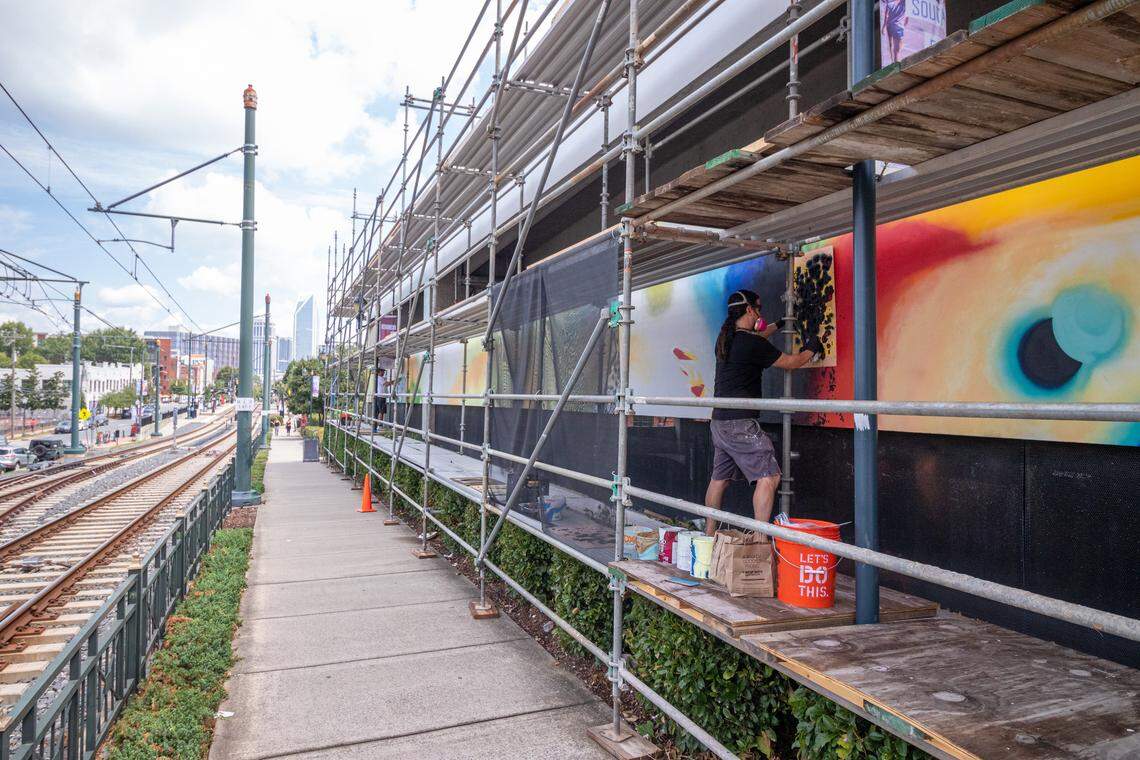 Ivan Depeña works on his latest piece of public art in Charlotte. His first, an interactive light piece for a government center, was completed in 2011 in Miami.