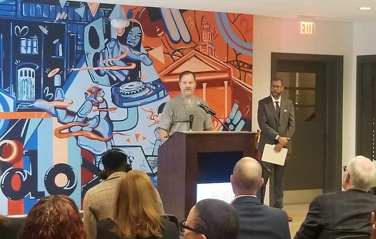 Bryan Moore, co-owner of NoDa Bodega, speaks about challenges as a small business owner in Charlotte at an event unveiling a new loan program in Charlotte.