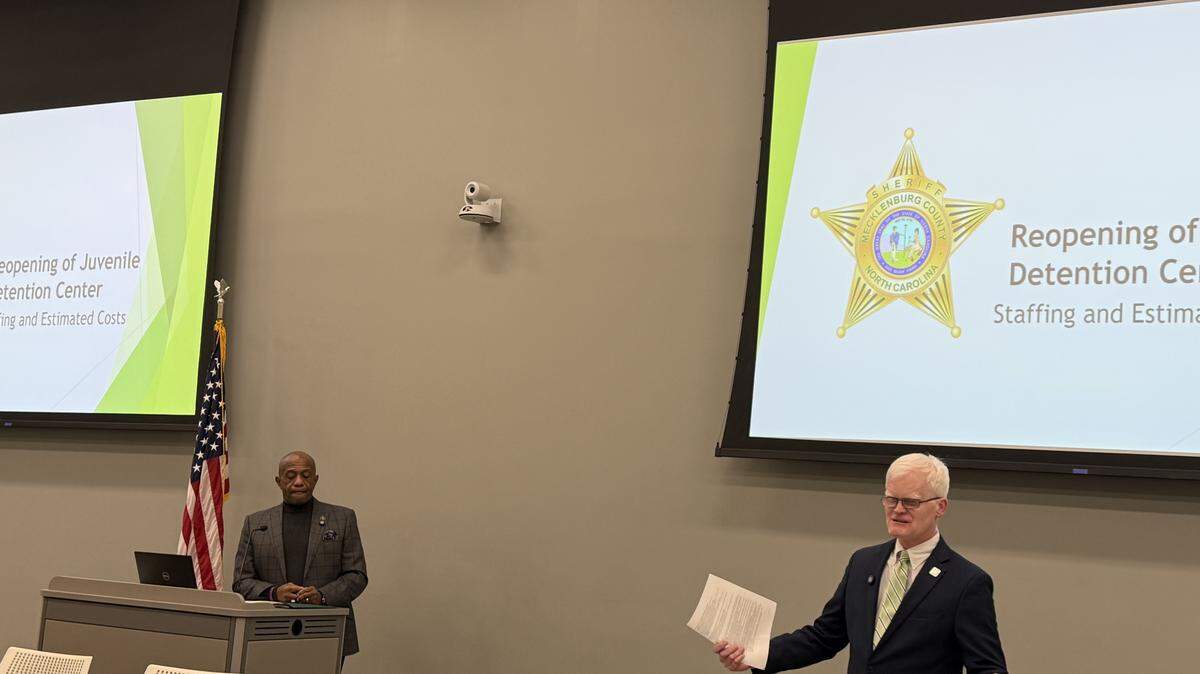 Sheriff Garry McFadden and William Lassiter of the North Carolina Department of Public Safety speak at a forum in Mecklenburg County on Jan. 6, 2026.
