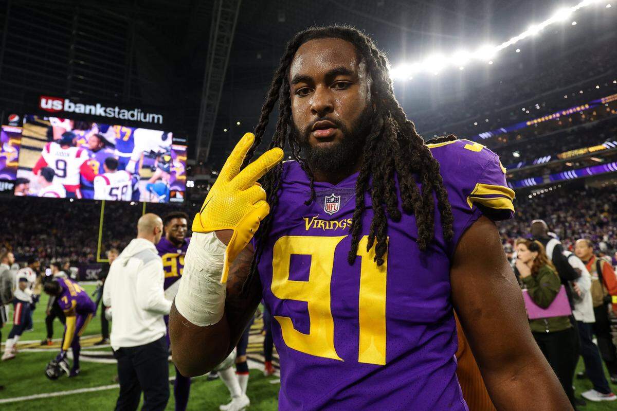 Nov 24, 2022; Minneapolis, Minnesota, USA; Minnesota Vikings linebacker Patrick Jones II (91) celebrates after defeating the New England Patriots after the game at U.S. Bank Stadium. Mandatory Credit: Matt Krohn-USA TODAY Sports