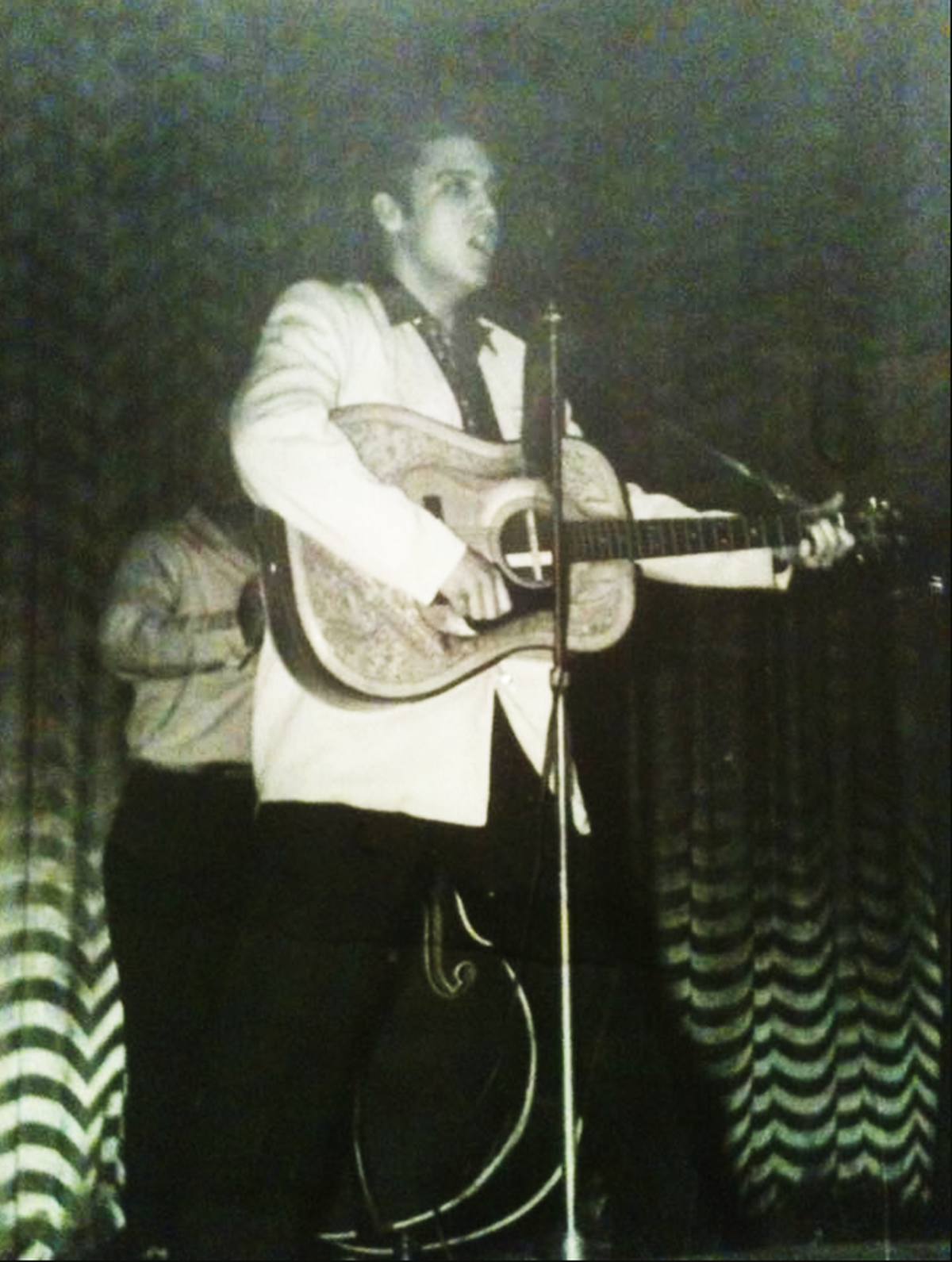 Elvis Presley, seen here on stage at Carolina Theatre in uptown Charlotte on Feb. 10, 1956.