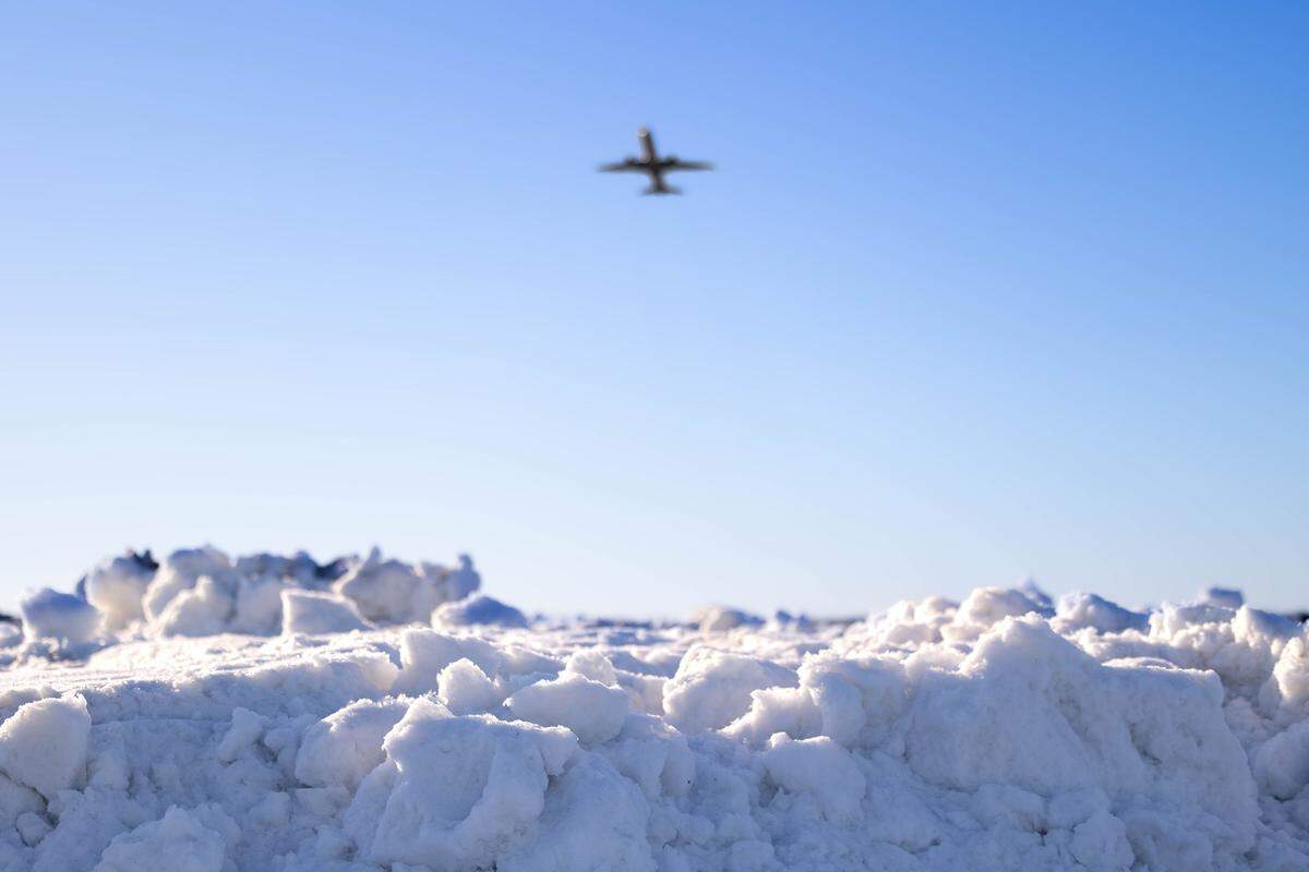 Charlotte airport crew cleared all three runways Sunday in the aftermath of a massive snowstorm, and operations were beginning to resume to normal Monday. American Airlines, the largest provider of flights, will operate the majority of its flight schedule. 