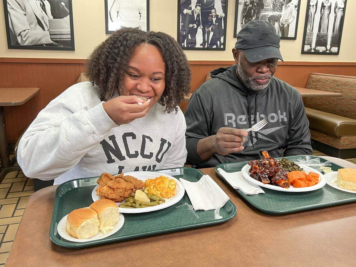CharlotteFive writer DeAnna Taylor and Tyrone Floyd share a meal at Floyd’s Restaurant.
