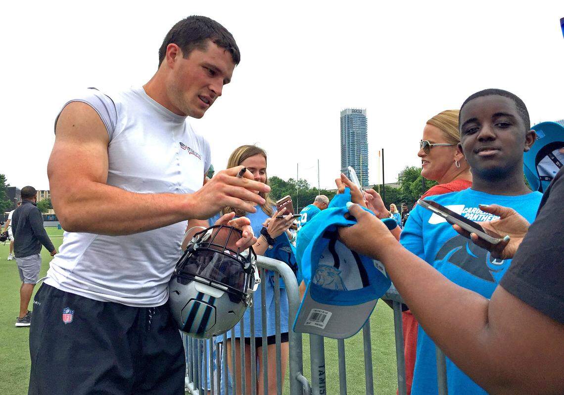 Carolina Panthers linebacker Luke Kuechly stops to sign autographs for fans following practice on Tuesday, June 12, 2018, and stayed long after the day's workout was over. Kuechly, who is still rehabilitating his right shoulder after surgery to repair a torn labrum, expects to return to full participation by training camp.