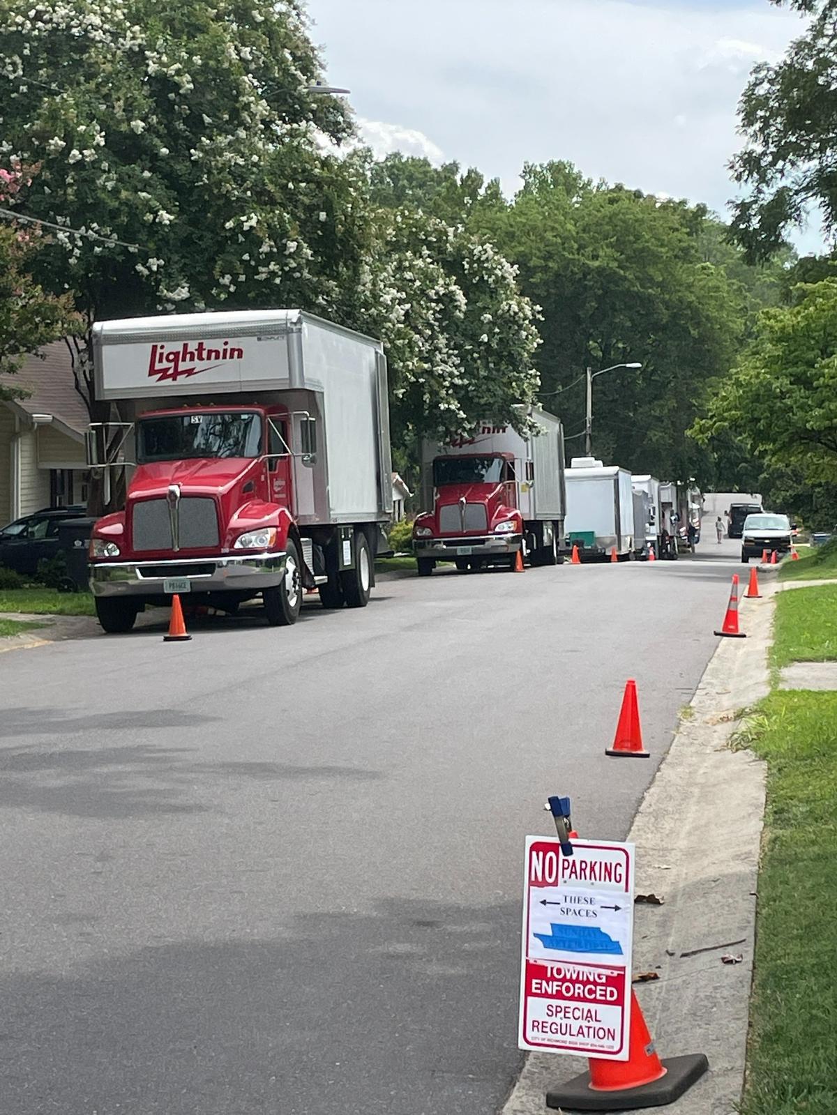 Trucks line a NoDa street during filming of “Please Don’t Destroy: The Treasure of Foggy Mountain” in 2022.