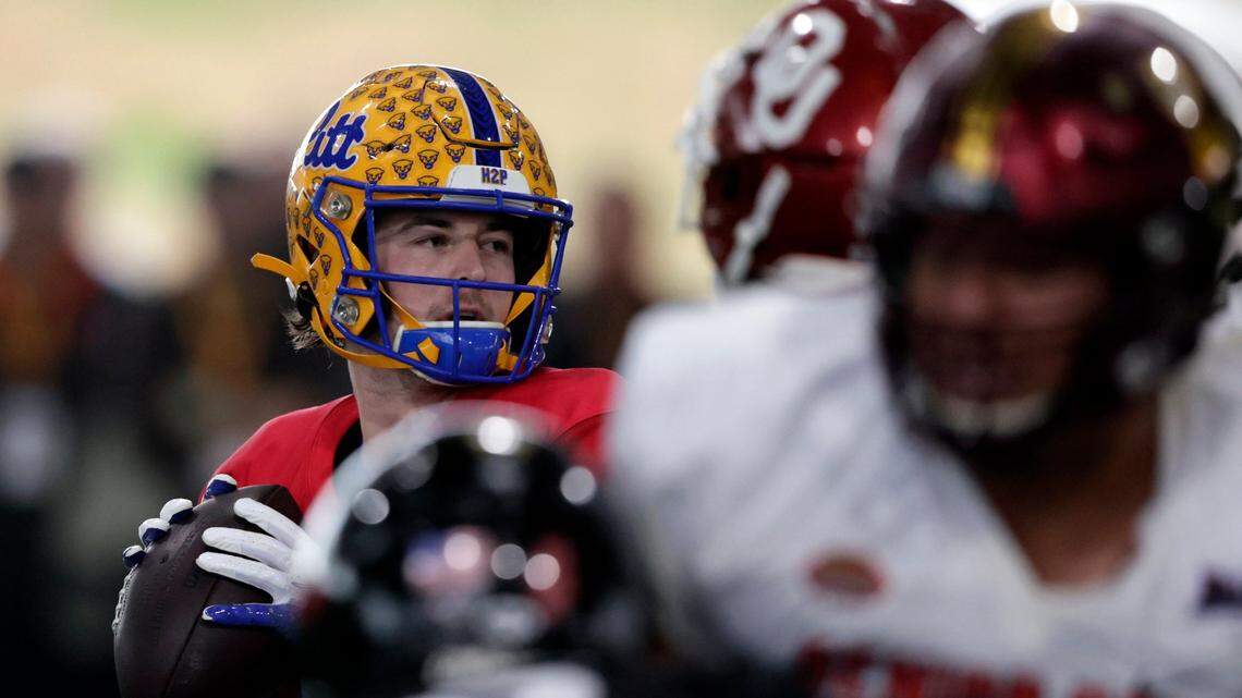 National Team quarterback Kenny Pickett of Pittsburgh (8) runs through drills during practice for the Senior Bowl NCAA college football game Thursday, Feb. 3, 2022, in Mobile, Ala. (AP Photo/Butch Dill)