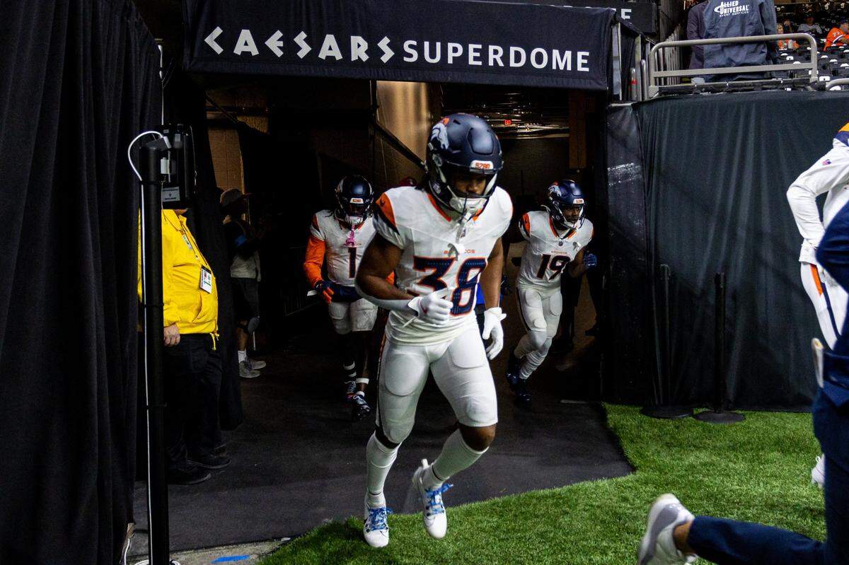 Oct 17, 2024; New Orleans, Louisiana, USA;  Denver Broncos running back Jaleel McLaughlin (38)  runs out the tunnel during the warmups before the game against the New Orleans Saints at Caesars Superdome. Mandatory Credit: Stephen Lew-Imagn Images