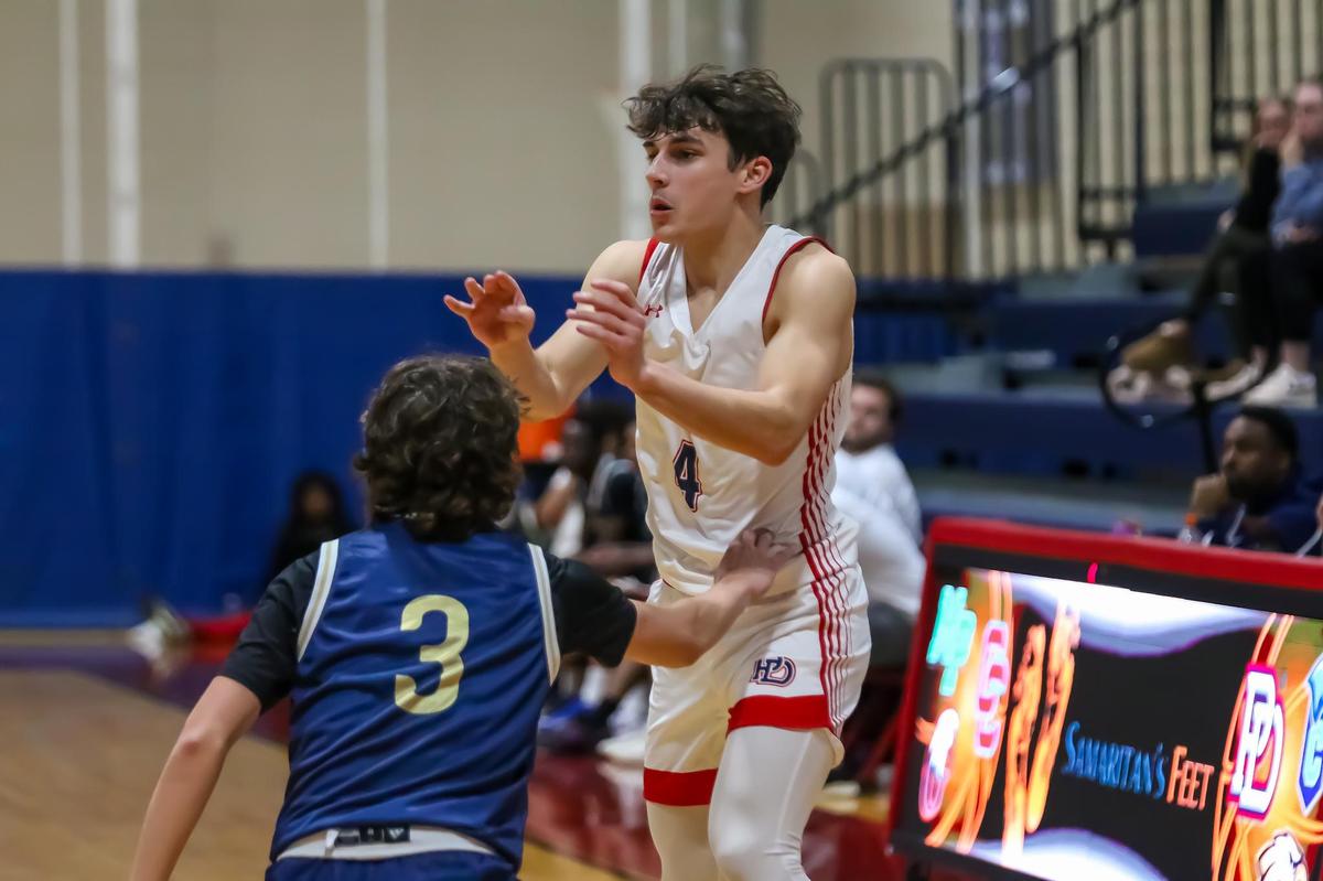 Providence Day Sean Dunn passes the ball to his teammate at the Concord Academy and Providence Day game at Providence Day high school on Dec 14th, 2024