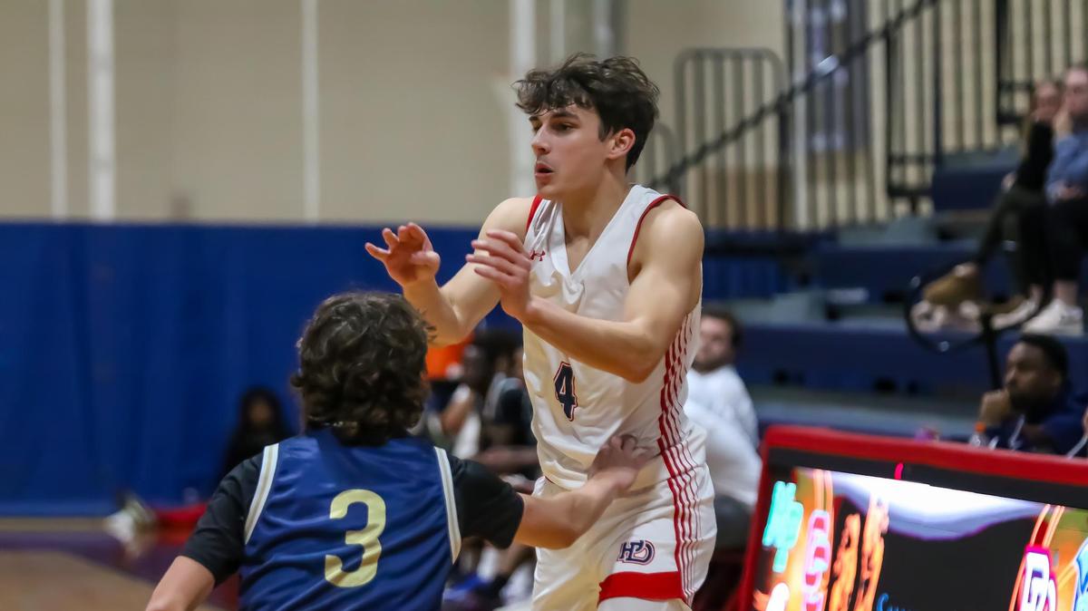 Providence Day Sean Dunn passes the ball to his teammate at the Concord Academy and Providence Day game at Providence Day high school on Dec 14th, 2024