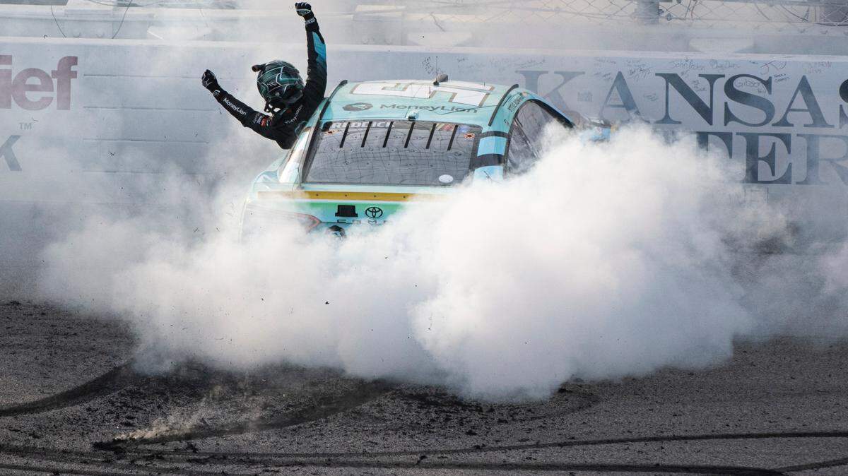 NASCAR Cup Series driver Tyler Reddick (45) celebrates winning the NASCAR Cup Series Hollywood Casino 400 at Kansas Speedway. 