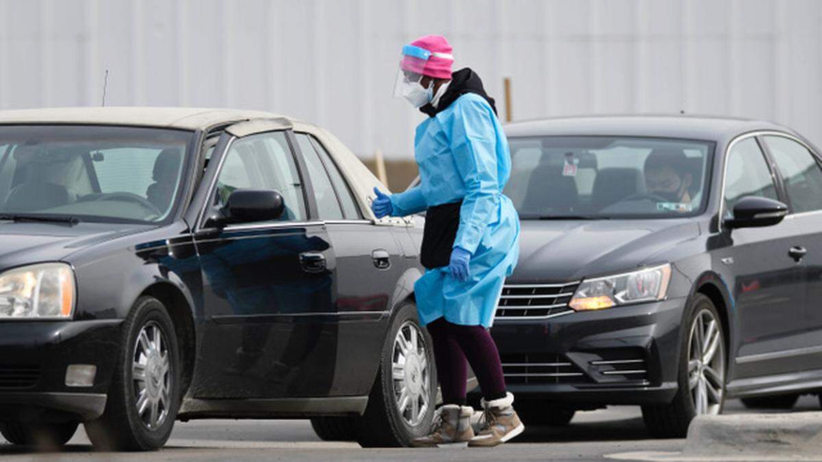 Medical personnel process drive-thru COVID-19 testing at StarMed Family & Urgent Care on Thursday, February 4, 2021.