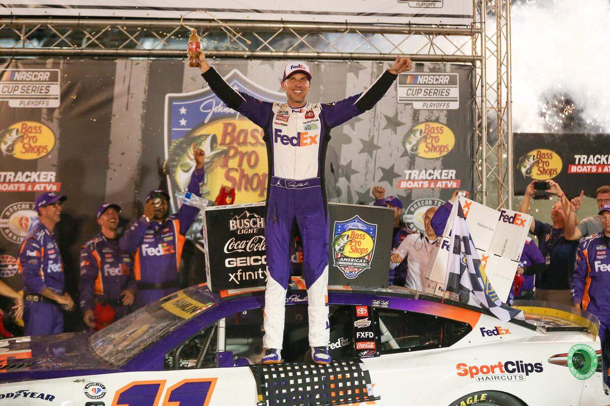 Sep 16, 2023; Bristol, Tennessee, USA; NASCAR Cup Series driver Denny Hamlin (11) wins the Bass Pro Shops Night Race at Bristol Motor Speedway.