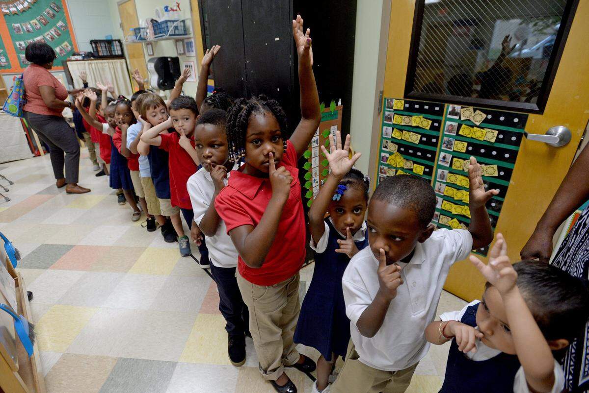 Children line up to go outside in a Pre-K class at Smart Kids No. 1, 225 Lambeth Drive in Charlotte.
