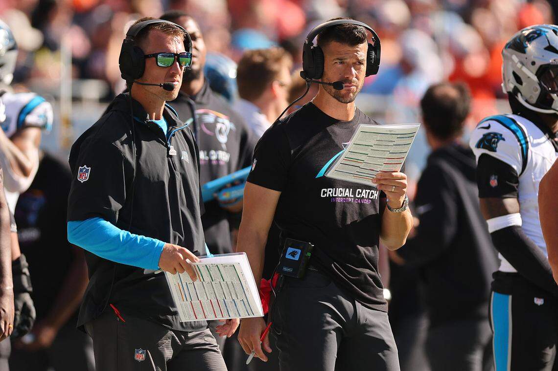 Carolina Panthers offensive coordinator Brad Idzik and head coach Dave Canales during a 2024 game against the Chicago Bears at Soldier Field. 
