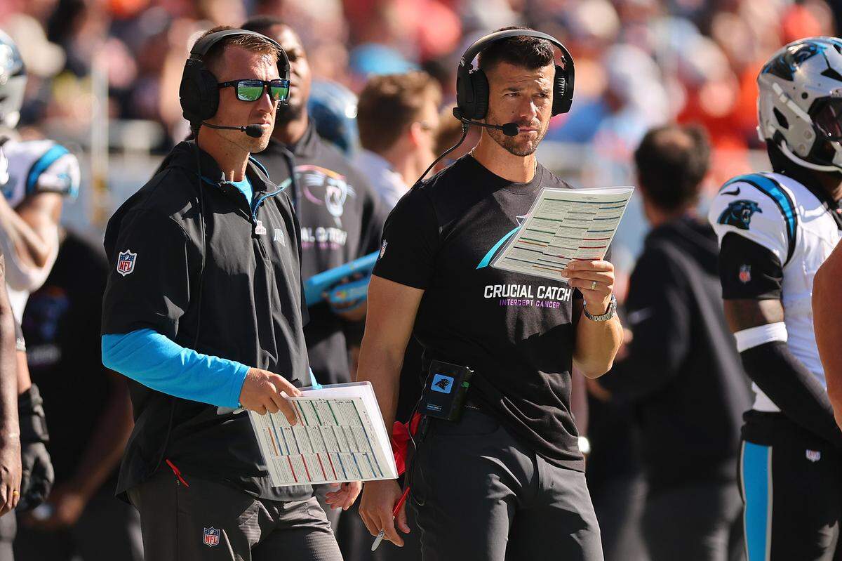Carolina Panthers offensive coordinator Brad Idzik and head coach Dave Canales look on against the Chicago Bears during the fourth quarter at Soldier Field on October 06, 2024 in Chicago, Illinois. (Photo by Michael Reaves/Getty Images)