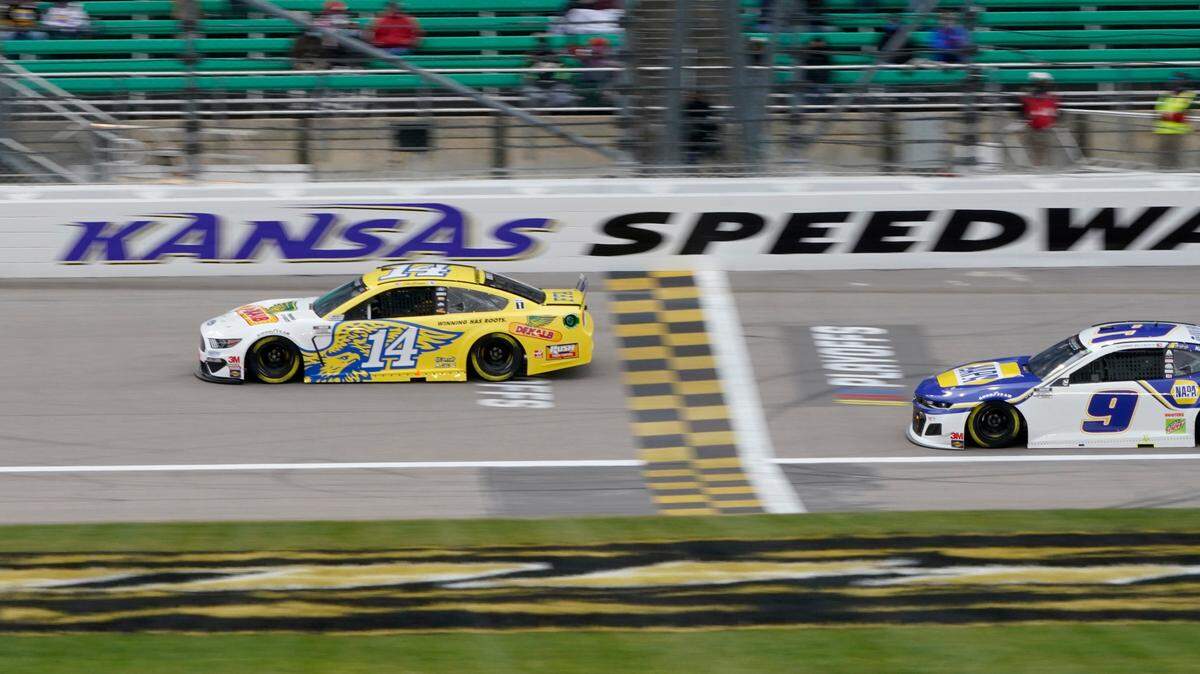Clint Bowyer (14) leads a pace lap in honor of his final season before a NASCAR Cup Series auto race at Kansas Speedway in Kansas City, Kan., Sunday, Oct. 18, 2020. (AP Photo/Orlin Wagner)