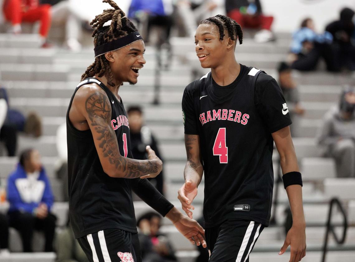 Chamber’s Markus Kerr (1) celebrates Tarris Bouie III (4) dunk during late 2nd quarter action. Cox Mill high school would host the Mike Gminski Classic Monday December 23, 2024.