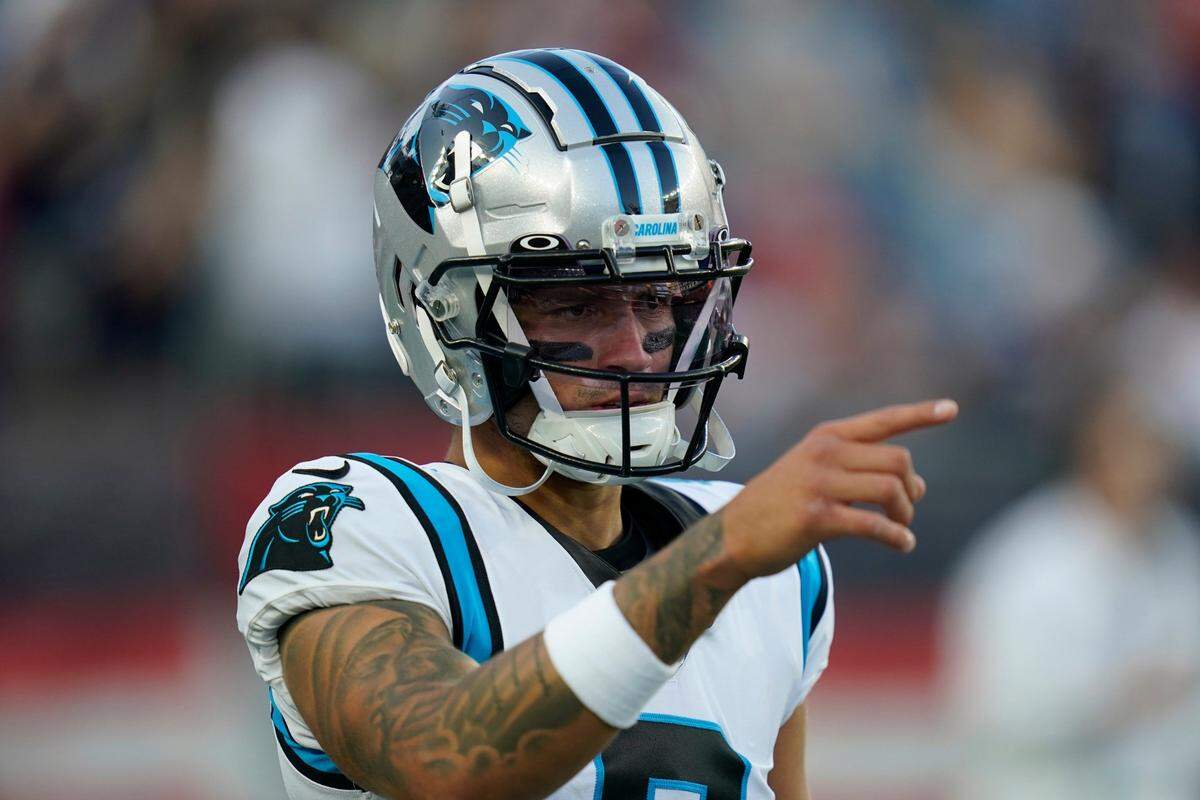 Carolina Panthers rookie quarterback Matt Corral (9) warms up prior to a preseason NFL football game against the New England Patriots, Friday, Aug. 19, 2022, in Foxborough, Mass. Corral left the game in the fourth quarter with a foot injury.