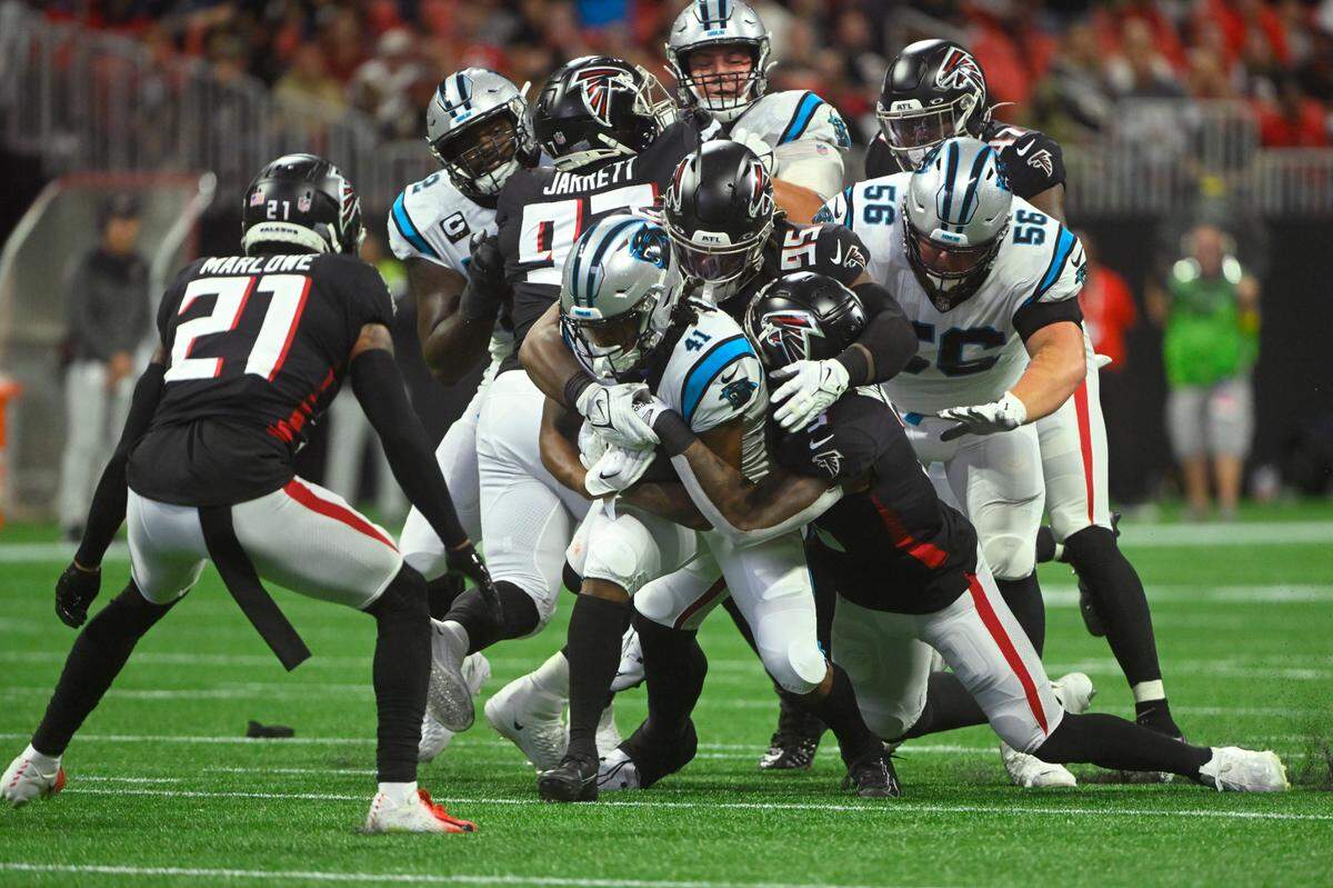 Carolina Panthers running back Spencer Brown (41) struggles for yardage during the first half of an NFL football game against the Atlanta Falcons Sunday, Oct. 30, 2022, in Atlanta. (AP Photo/John Amis)