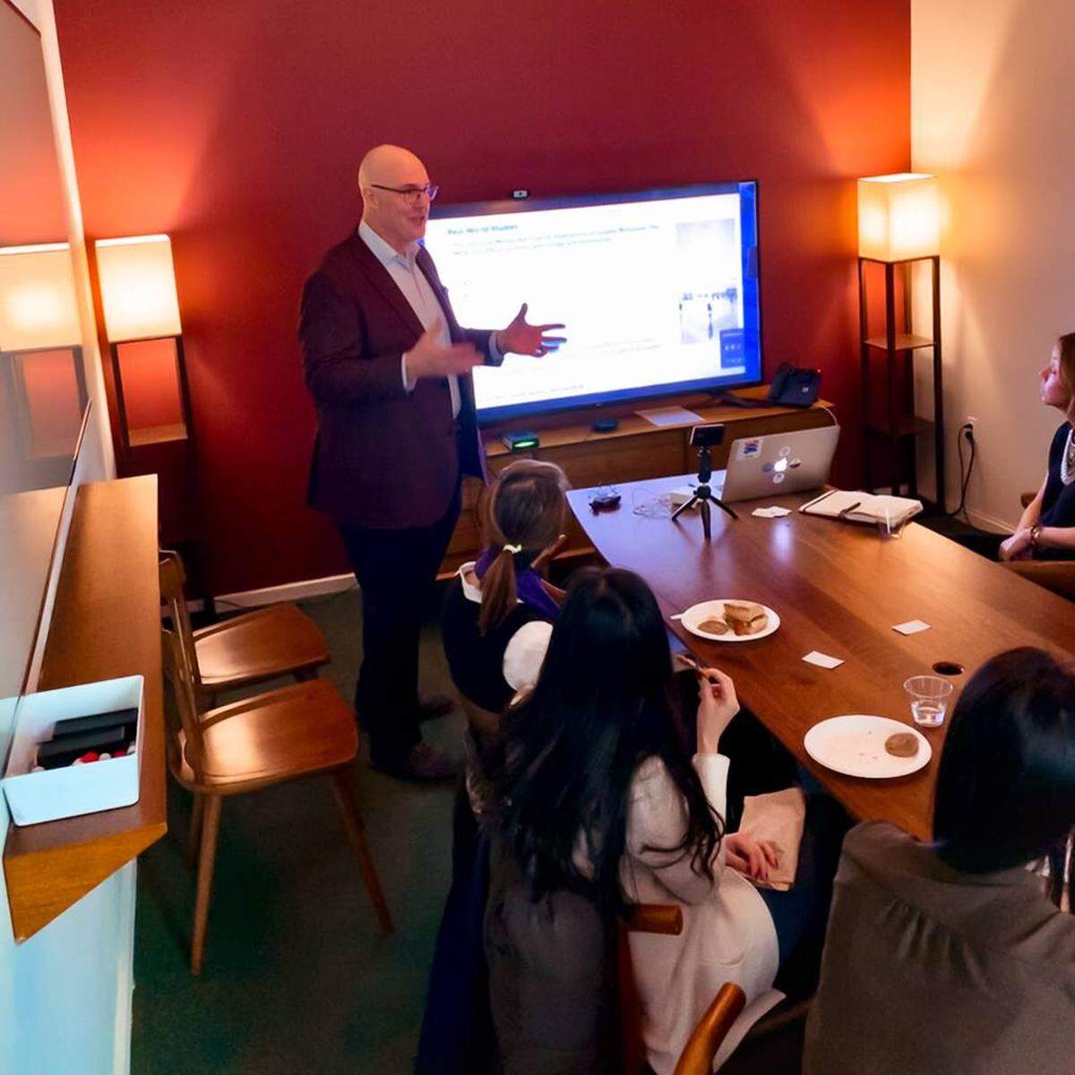 Joseph Franklyn McElroy leads a meeting during his day job in New York City.