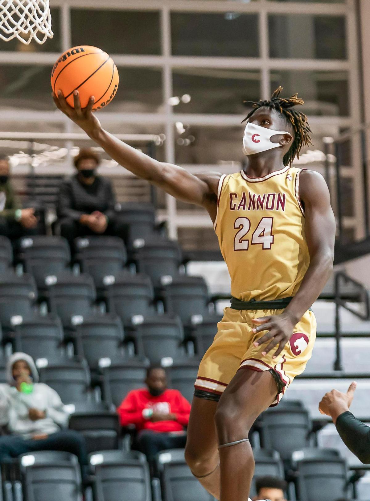 Cannon’s Karon Boyd (24) drives to the basket for the 2-point layup at the Phenom Holiday Classic Wednesday December 23, 2020.