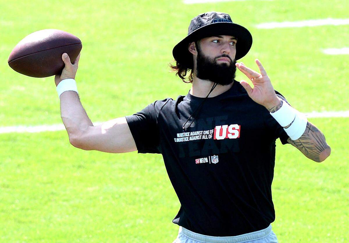 Carolina Panthers quarterback Will Grier throws a pass during his pregame routine at Bank of America Stadium on Sunday, September 13, 2020. All the players were wearing social justice t-shirts in unity during the warmup period. The Carolina Panthers will host the Las Vegas Raiders in NFL action with no fans in attendance due to the COVID-19 pandemic.