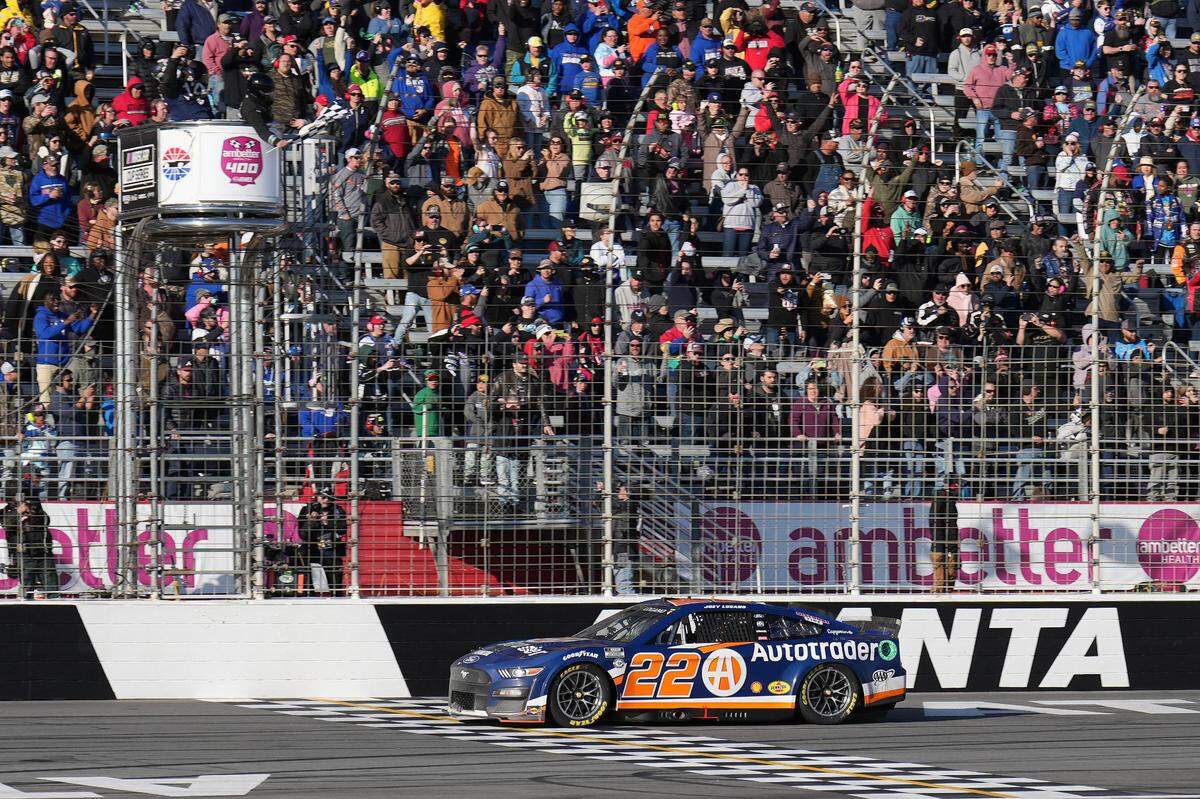 Mar 19, 2023; Hampton, Georgia, USA; NASCAR Cup Series driver Joey Logano (22) wins at Atlanta Motor Speedway.