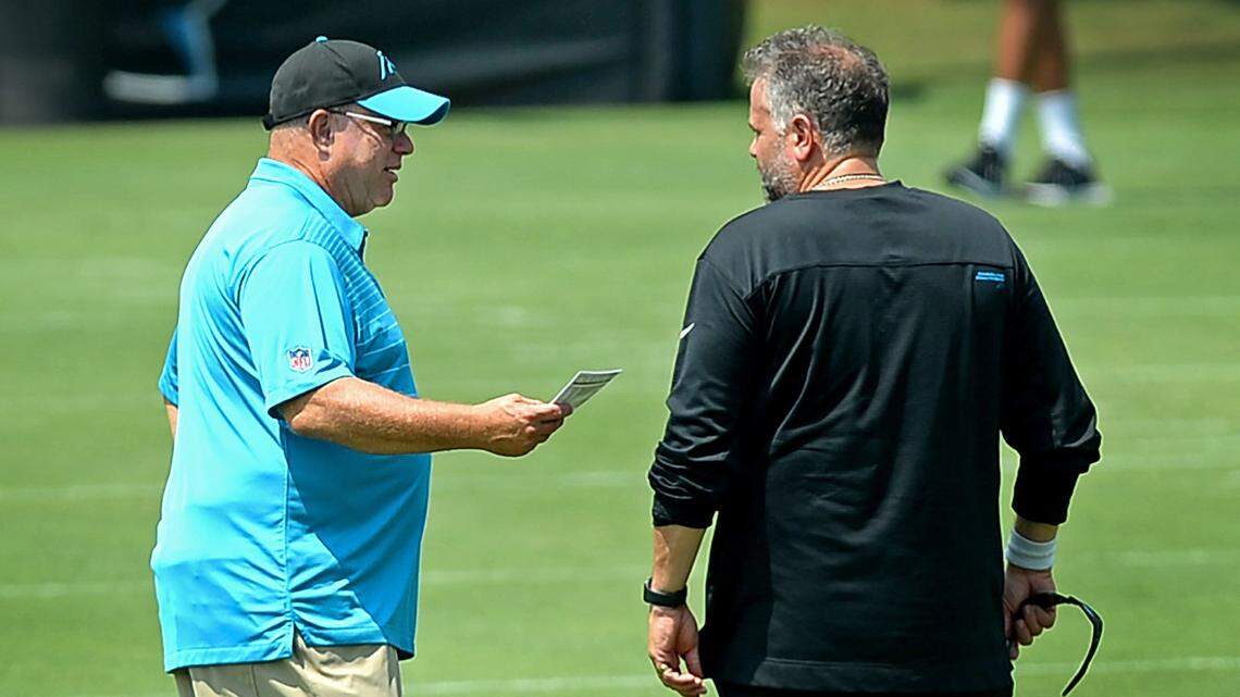 Carolina Panthers team owner David Tepper, left and head coach Matt Rhule, right, talk during practice on Wednesday, August 25, 2021.