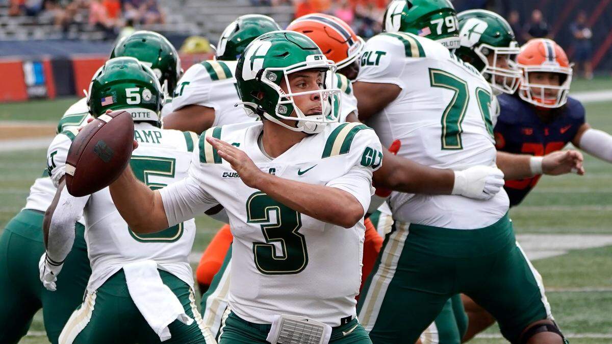 Charlotte quarterback Chris Reynolds sets up to pass during the first half of an NCAA college football game against Illinois Saturday, Oct. 2, 2021, in Champaign, Ill. (AP Photo/Charles Rex Arbogast)