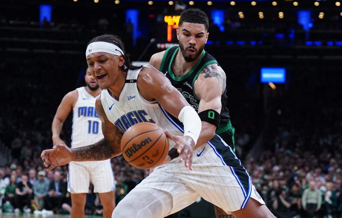 Boston Celtics forward Jayson Tatum (0) defends against Orlando Magic forward Paolo Banchero (5) in the second quarter during Game 5 of first round of the 2025 NBA playoffs.